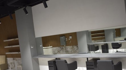 Modern salon interior at Lux Cuts N Colours, Bayswater, Victoria, AU showcasing sleek styling station and mirrors.