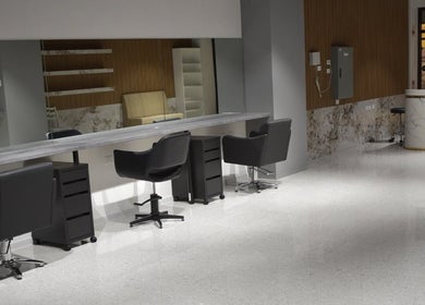 Modern interior of Lux Cuts N Colours in Bayswater, Victoria, AU with sleek salon chairs and mirrors.