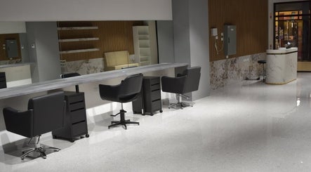 Modern interior of Lux Cuts N Colours in Bayswater, Victoria, AU with sleek salon chairs and mirrors.