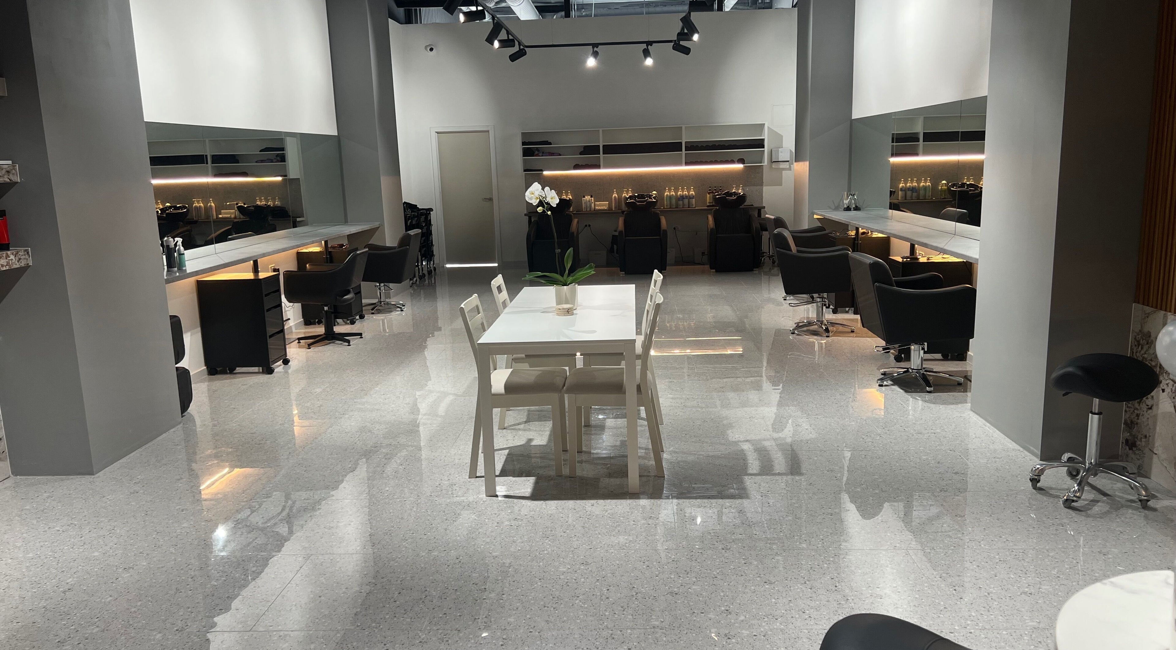 Lux Cuts N Colours beauty salon interior in Bayswater, Victoria, AU with modern styling stations and sleek design.