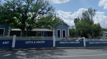 Front view of Blessing &Natasha Nails in Cape Town, Western Cape, ZA, with welcoming blue exterior and signage.