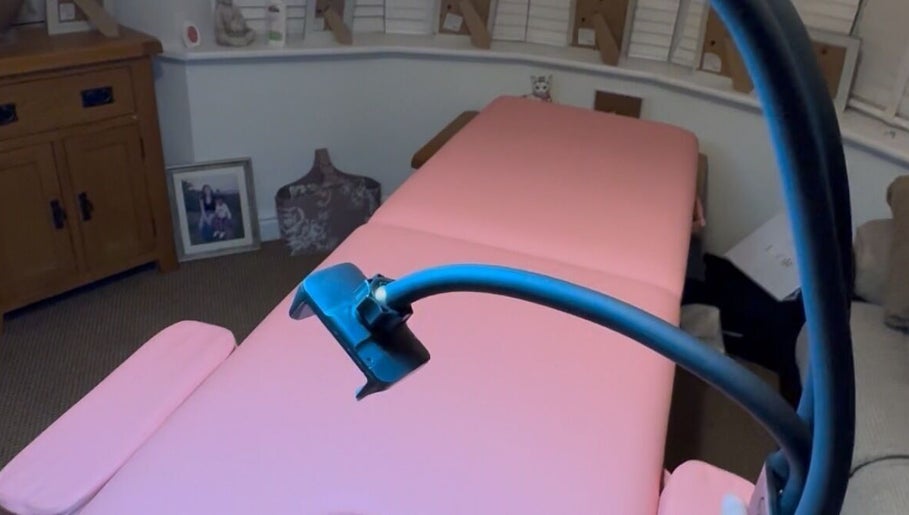 GetCleo.d wellness room with pink treatment table in Maidstone, England, GB.