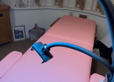 GetCleo.d wellness room with pink treatment table in Maidstone, England, GB.