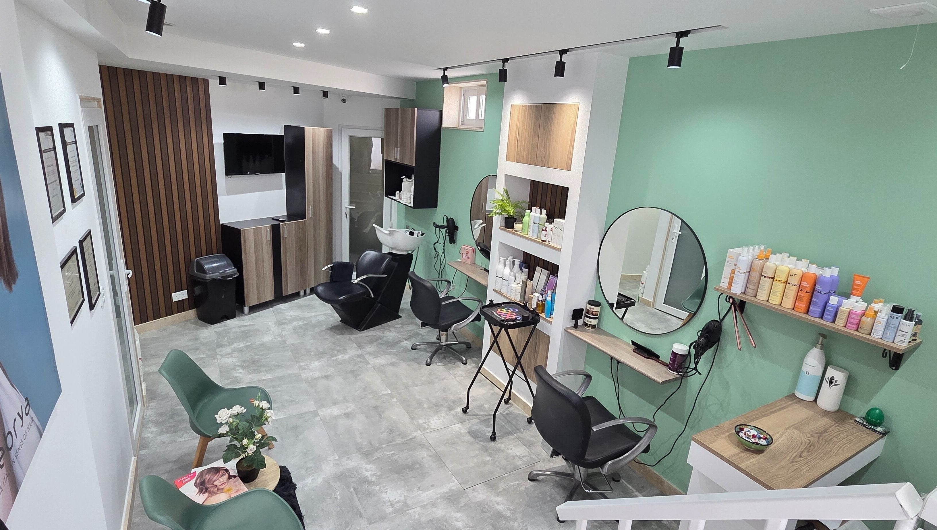 VV Hair Studio in Ħ'attard, MT, features modern salon chairs and styling stations in a serene setting.
