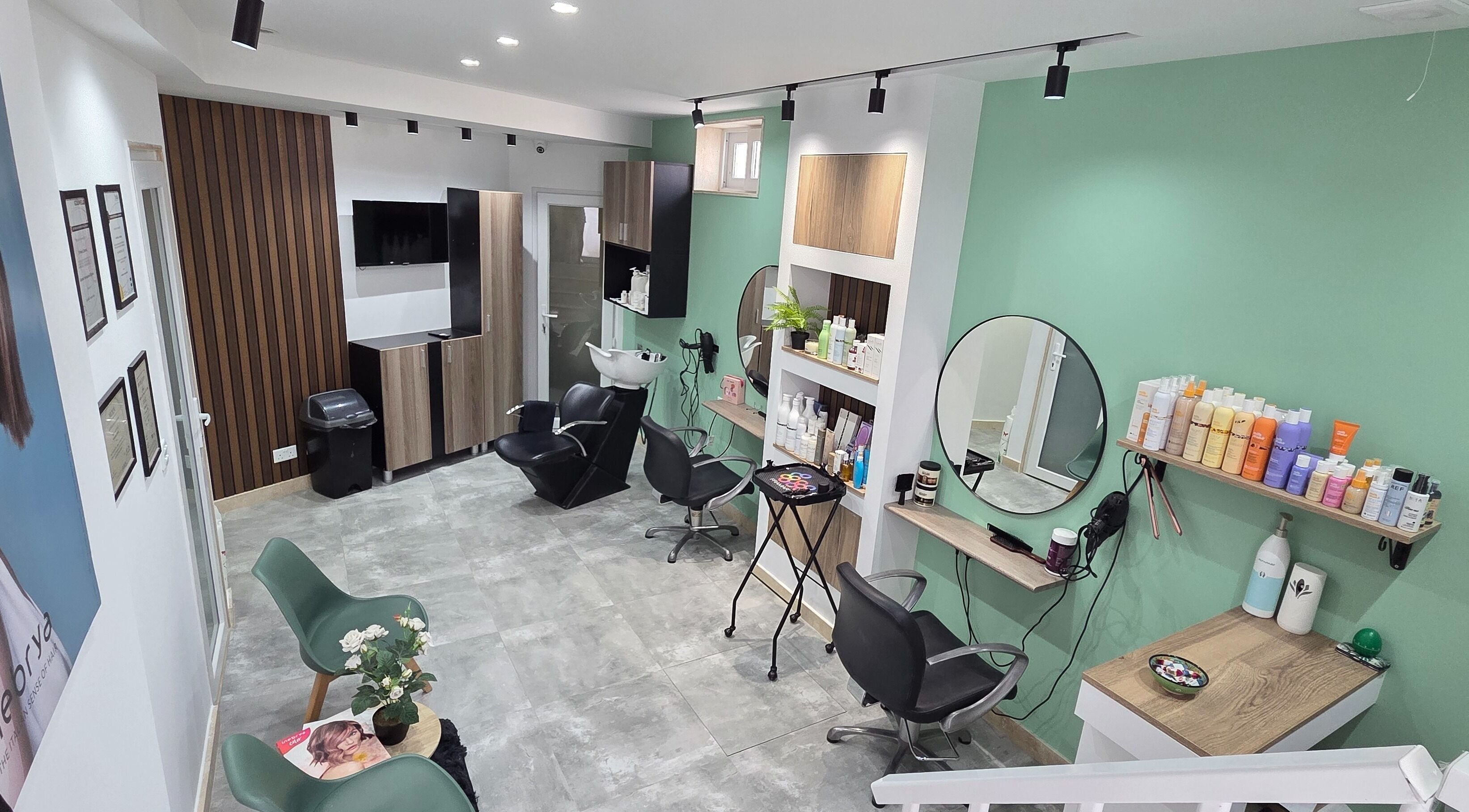VV Hair Studio in Ħ'attard, MT, features modern salon chairs and styling stations in a serene setting.