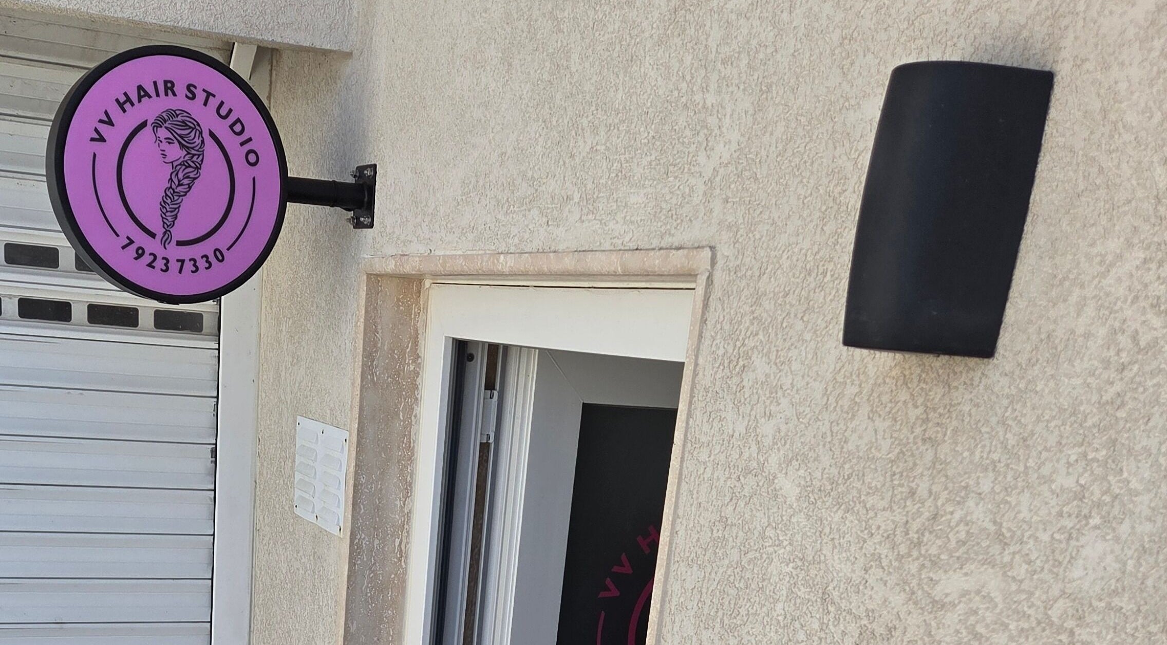 VV Hair Studio entrance with vibrant purple sign in Ħ'attard, MT.