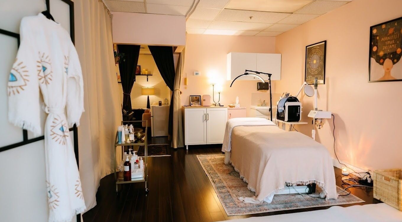 Tranquil treatment room at LunaSoul Wellness in Vancouver, BC, CA with massage bed and calming decor.
