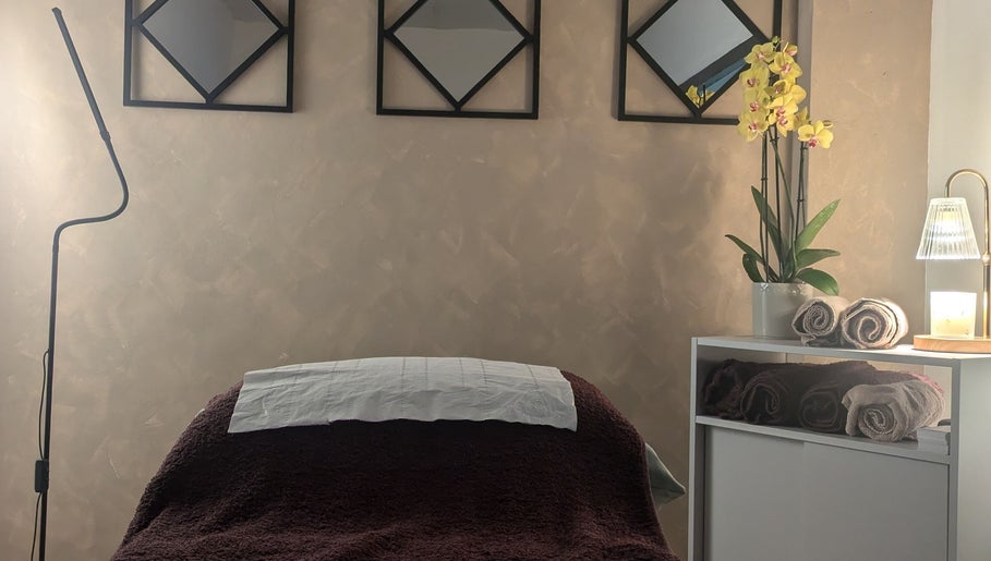 Tranquil treatment room at I J Beauty By Lauren, St Helens, England, GB with cozy bed and relaxing decor.