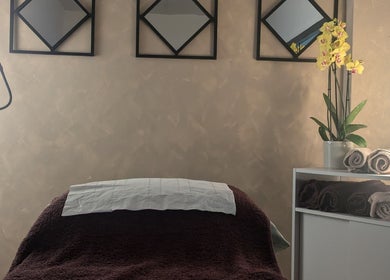 Tranquil treatment room at I J Beauty By Lauren, St Helens, England, GB with cozy bed and relaxing decor.