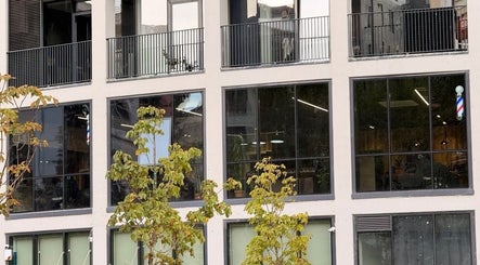 Exterior of The Dapper Fox Barber in Tiranë, Tirana County, AL showcasing its modern facade.