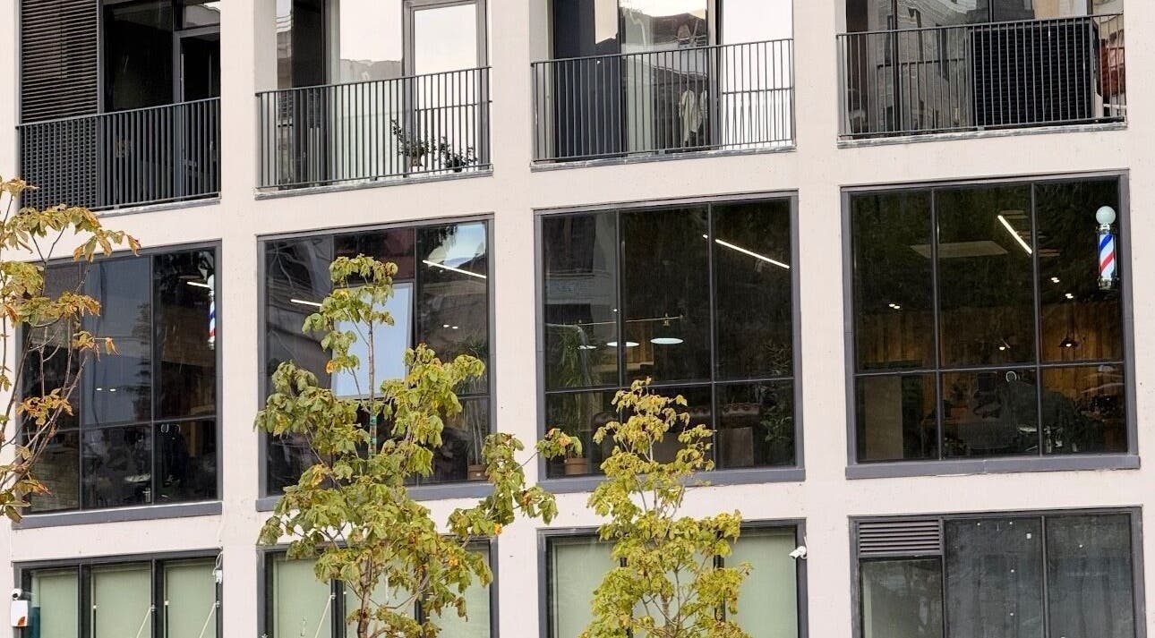 Exterior of The Dapper Fox Barber in Tiranë, Tirana County, AL showcasing its modern facade.