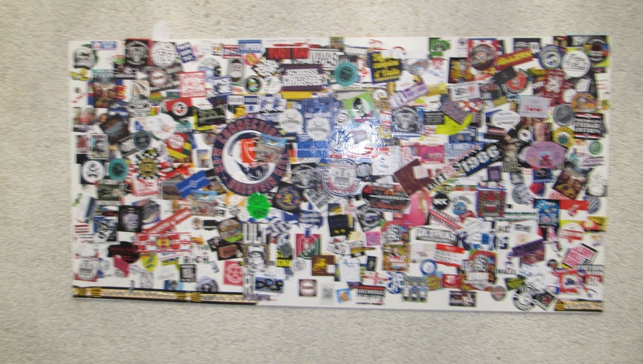 Vibrant sticker collage wall at Soul Frizerski Studio, Nova Gorica, Nova Gorica, SI.
