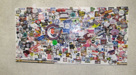 Vibrant sticker collage wall at Soul Frizerski Studio, Nova Gorica, Nova Gorica, SI.