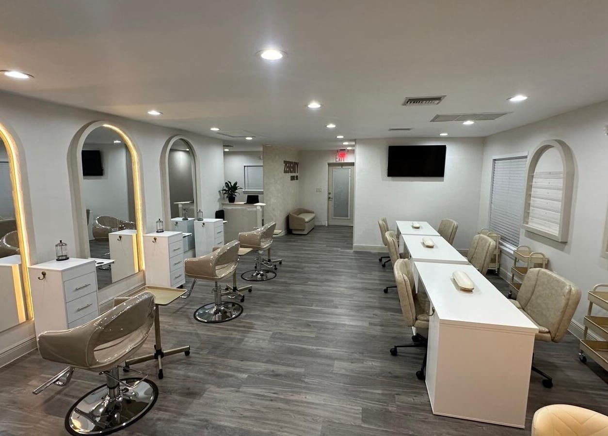 Modern salon interior at Lizzy, Cape Coral, Florida, US, featuring elegant chairs and stylish decor.