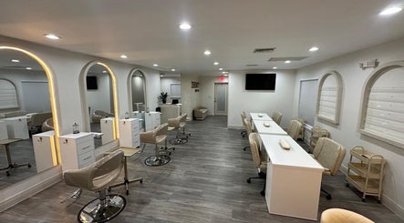 Modern salon interior at Lizzy, Cape Coral, Florida, US, featuring elegant chairs and stylish decor.