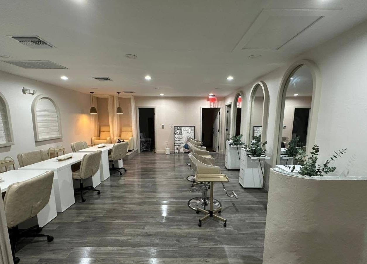 Elegant beauty salon at Lizzy, Cape Coral, Florida, US, featuring luxurious seating and modern decor.