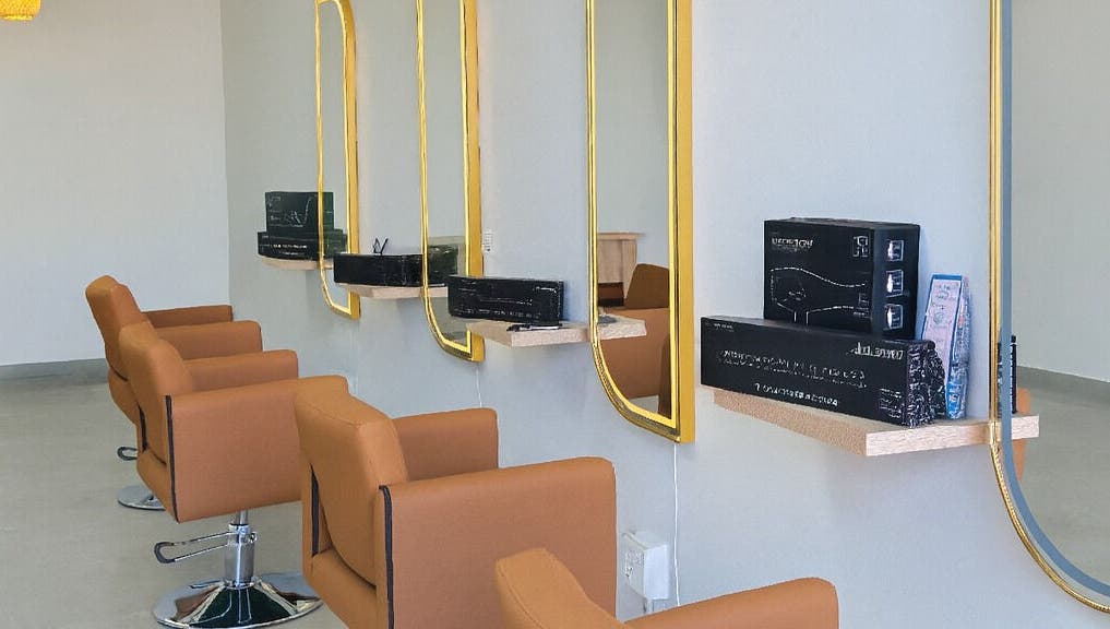 Sleek salon chairs and golden mirrors at Luxe Hair Salon & Extensions Supplier, Cape Town, Western Cape, ZA.