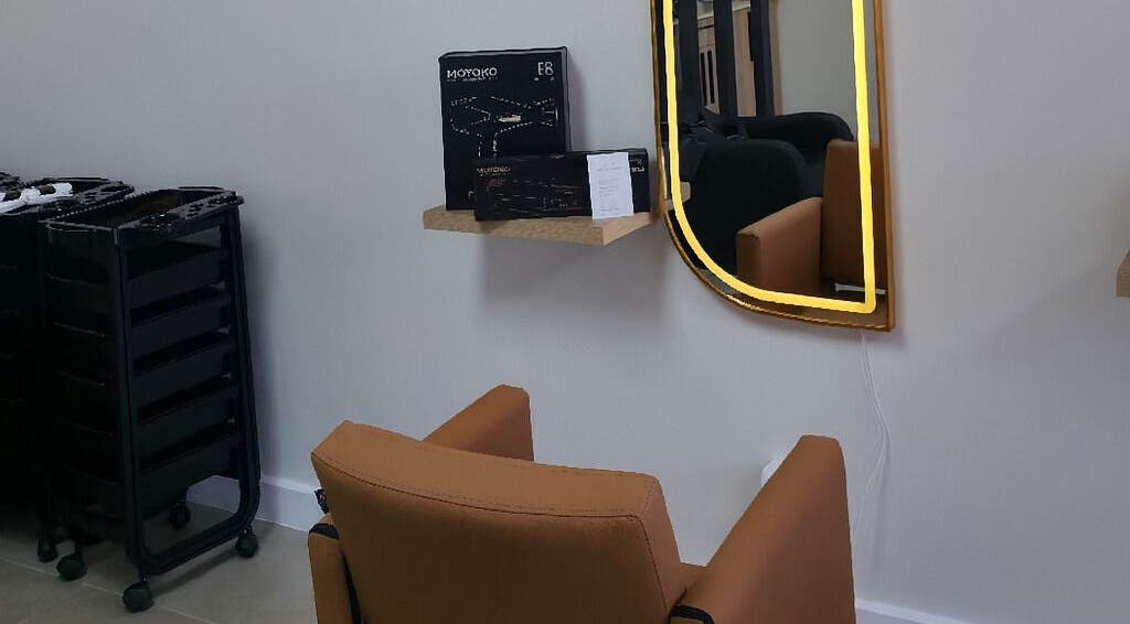 Modern salon chair and mirror at Luxe Hair Salon & Extensions Supplier, Cape Town, Western Cape, ZA.