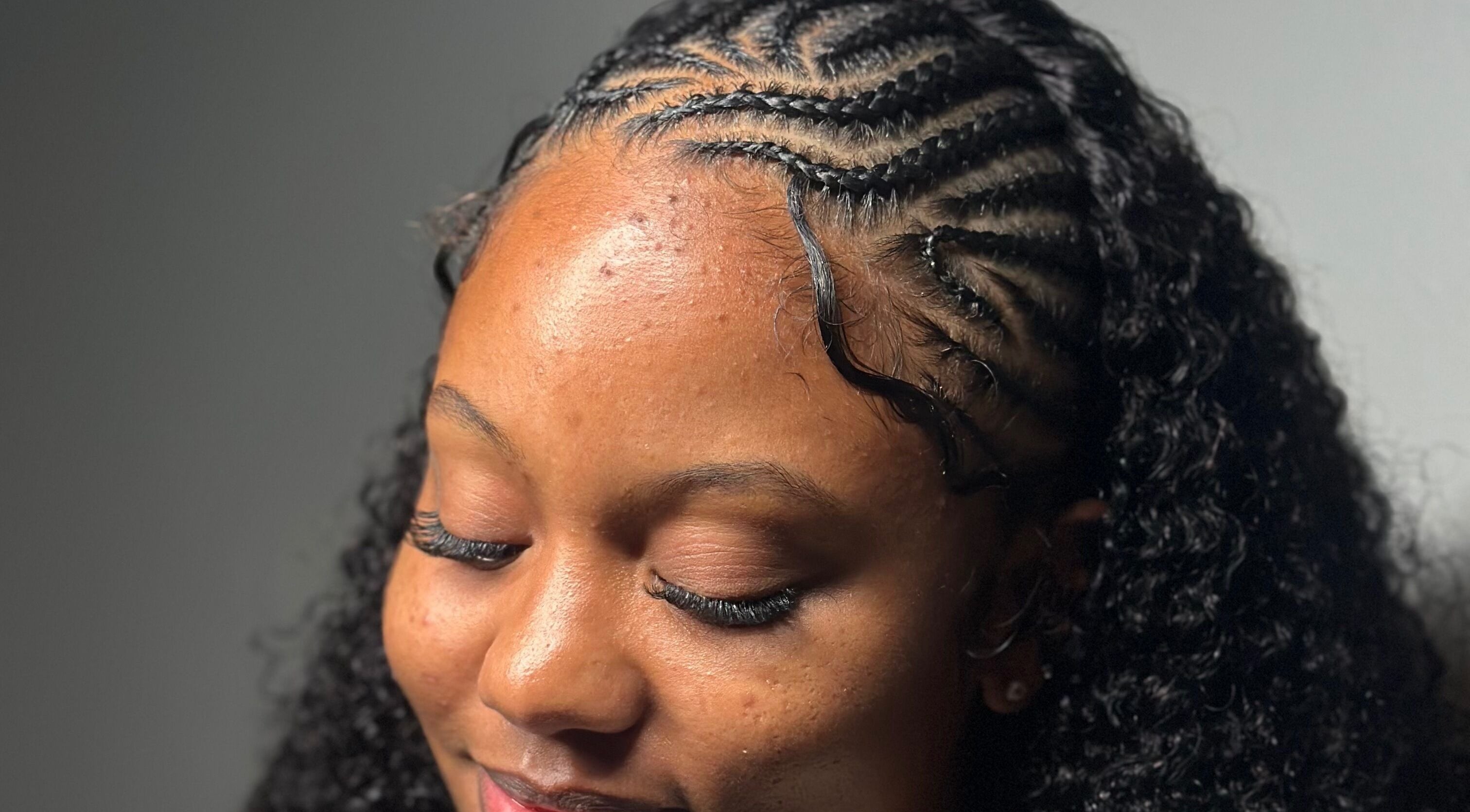 Close-up of intricate cornrow braids at The Lash Lounge, Kingston, St. Andrew Parish, JM.