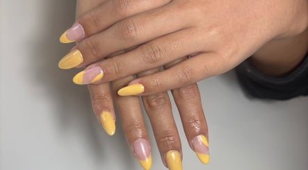 Yellow and pink manicured nails at Sunny Day Nail Studio, Waterford, Western Australia, AU.