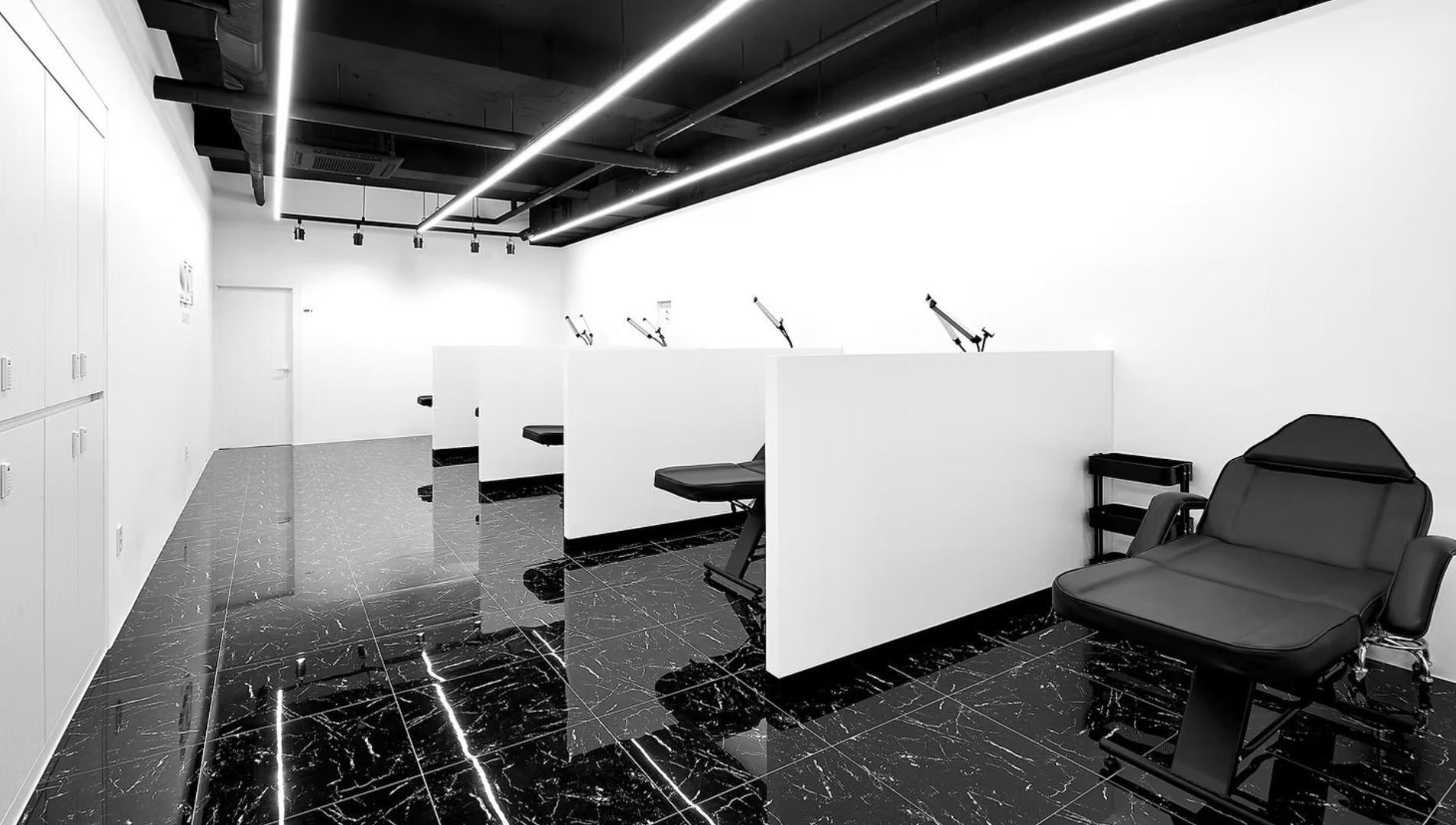 Modern, sleek interior of urGlow salon in Seoul, Seoul, KR with stylish black and white decor.