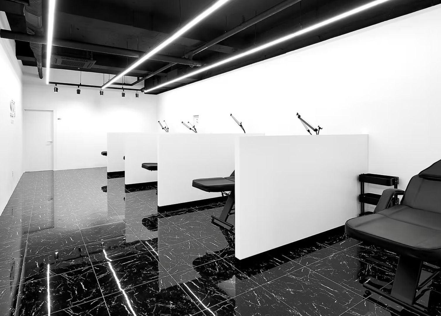 Modern, sleek interior of urGlow salon in Seoul, Seoul, KR with stylish black and white decor.