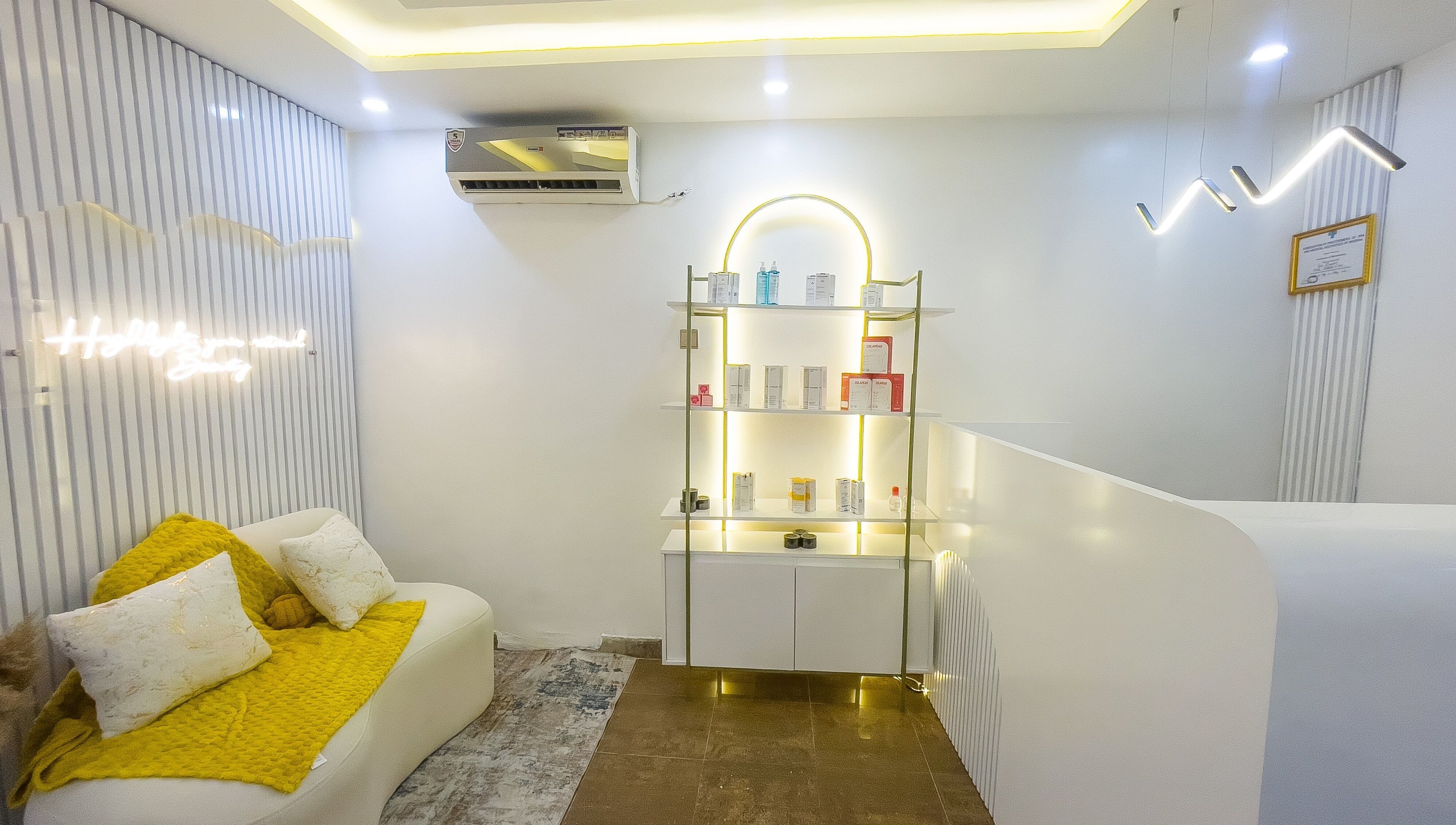 Elegant waiting area at Vitality Aesthetics & Spa, Lekki, Lagos, NG with modern decor and ambient lighting.