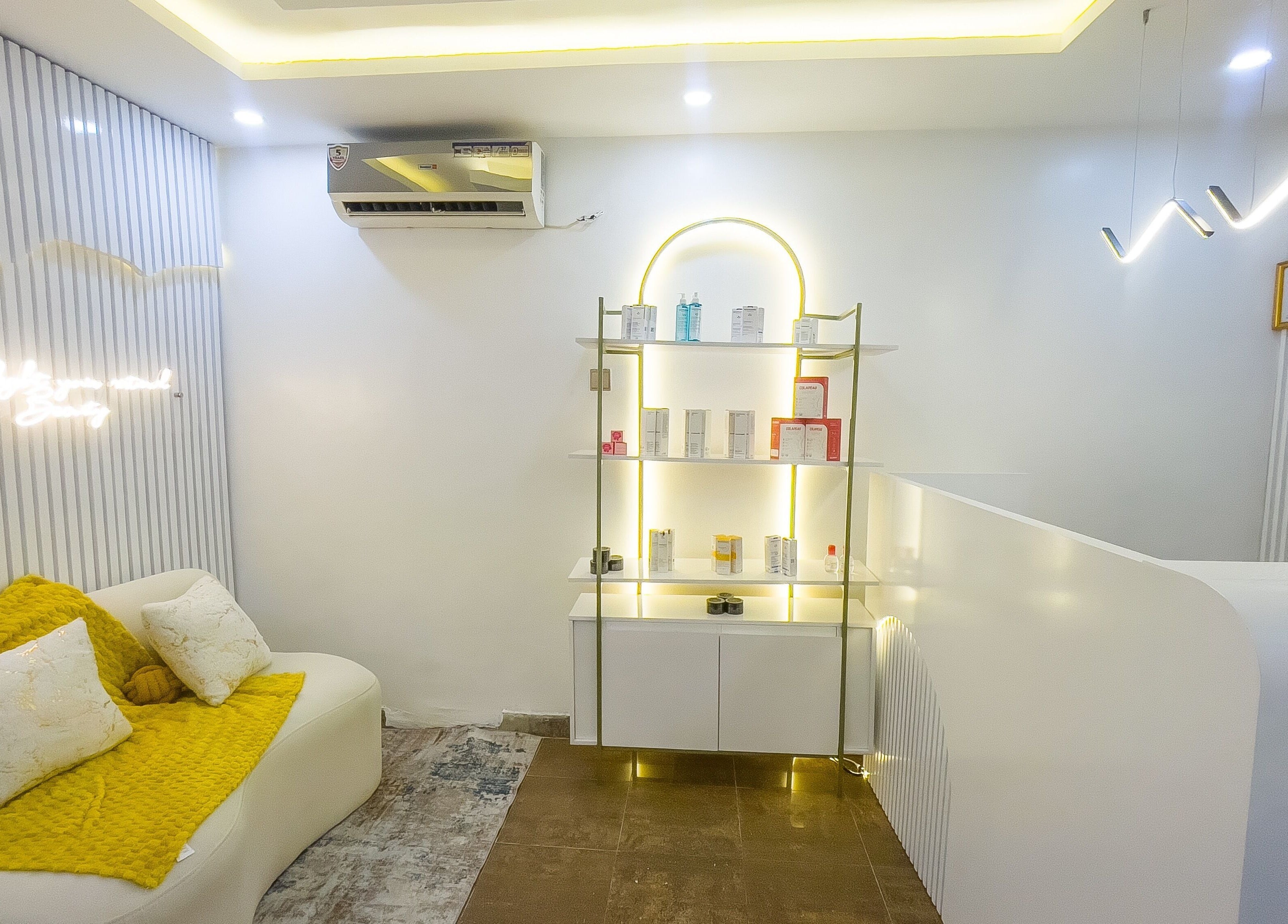 Elegant waiting area at Vitality Aesthetics & Spa, Lekki, Lagos, NG with modern decor and ambient lighting.