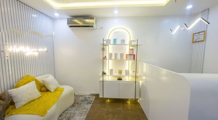 Elegant waiting area at Vitality Aesthetics & Spa, Lekki, Lagos, NG with modern decor and ambient lighting.