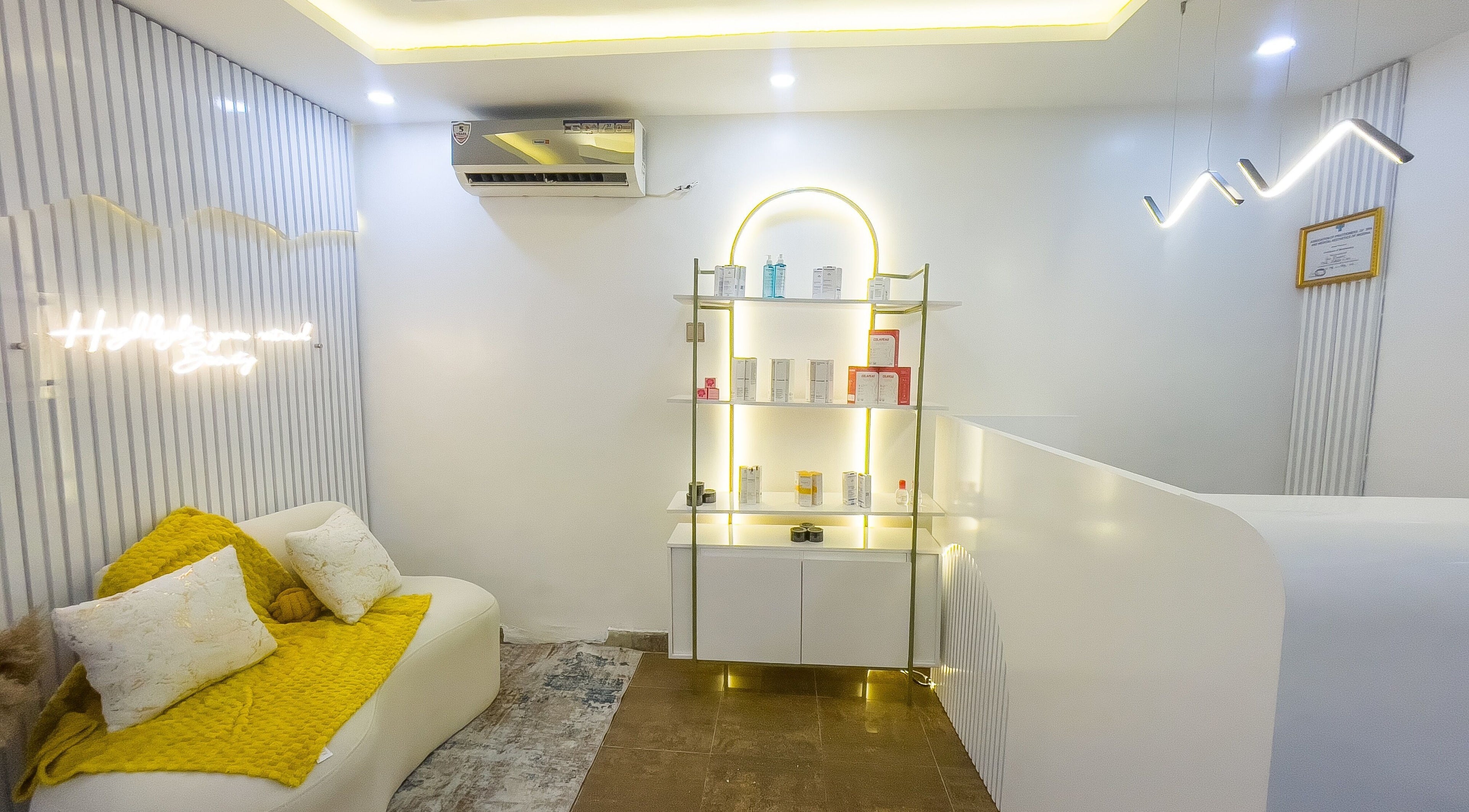 Elegant waiting area at Vitality Aesthetics & Spa, Lekki, Lagos, NG with modern decor and ambient lighting.