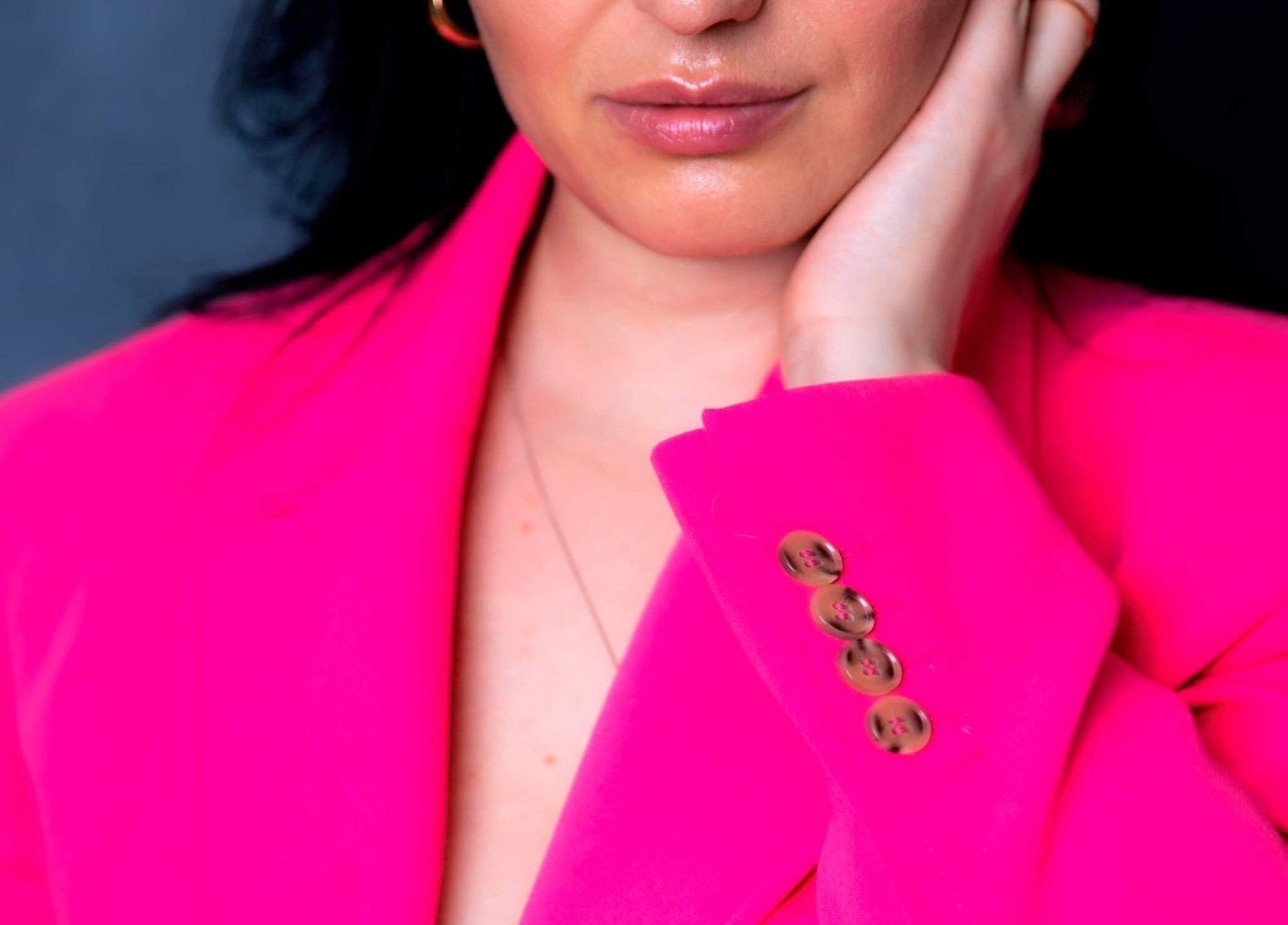 Stylish woman in pink blazer at Brows by Ardita, Coquitlam, British Columbia, CA.