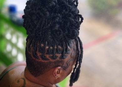 Intricate braided hairstyle at T'Hairapy Beauty Studio in Christ Church, Christ Church, BB.