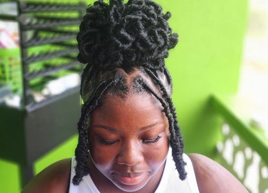 Stylish braided hairstyle at T'Hairapy Beauty Studio in Christ Church, Christ Church, BB.