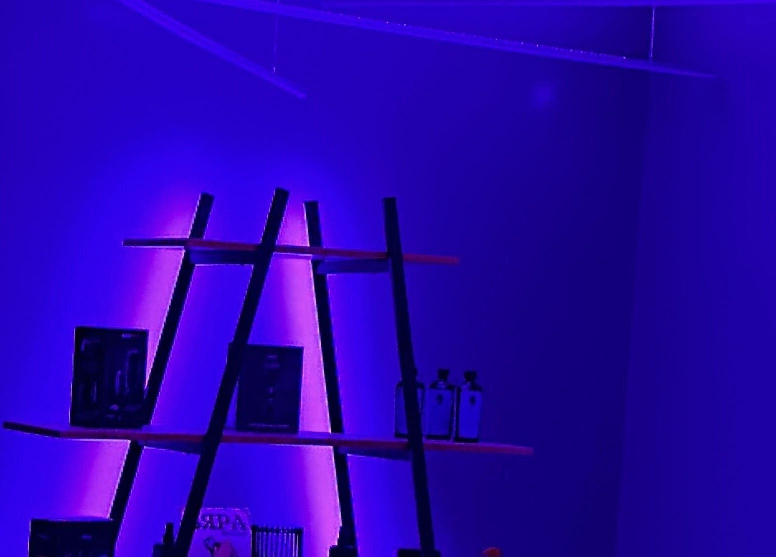 Chic shelving with vibrant lighting at Barbershop 24K Cutz, Stara Zagora, Stara Zagora, BG.