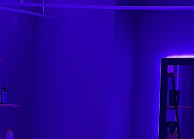 Stylish interior at Barbershop 24K Cutz in Stara Zagora, BG, featuring modern purple lighting.