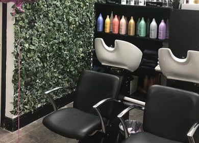 Stylish salon chairs and wash station at KC Phibrows & Beauty, Dublin, County Dublin, IE with lush greenery decor.