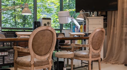 Elegant studio chairs at Brownee Studio x TNC Gallery, Singapore, SG, ideal for beauty treatments.