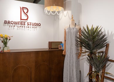 Entrance of Brownee Studio x TNC Gallery in Singapore featuring a stylish reception with decor.