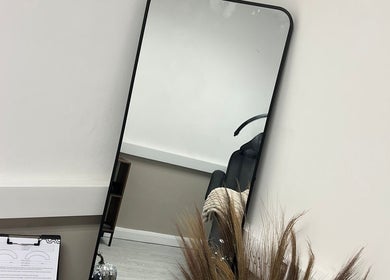 Elegant mirror at Urban Beauty by Leigha, Southampton, England, GB, showcasing serene salon interior.