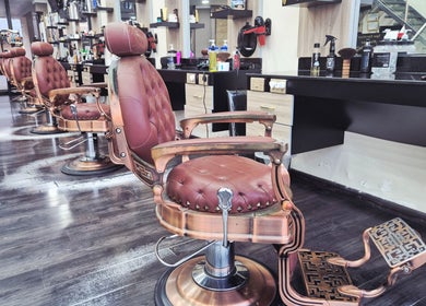 Elegant salon chairs at KUPA CARELINE SALON, Arad, Muḥāfaẓat Al-muḥarraq, BH, showcasing luxury styling.