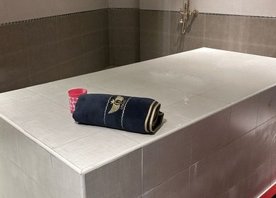 Luxurious spa room at KUPA CARELINE SALON, Arad, Muḥāfaẓat Al-muḥarraq, BH featuring a massage table and relaxing decor.