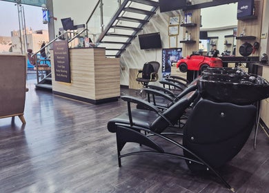 Interior of KUPA CARELINE SALON in Arad, Muḥāfaẓat Al-muḥarraq, BH featuring sleek salon chairs and stylish decor.