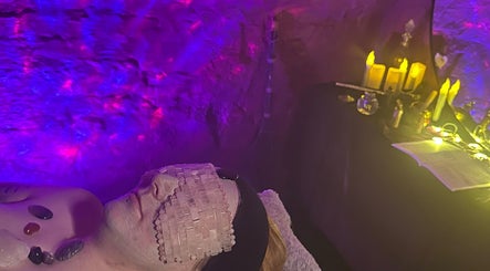 Relaxation therapy at Sorceress Beauty, Manchester, England, GB, featuring ambient lighting and healing stones.