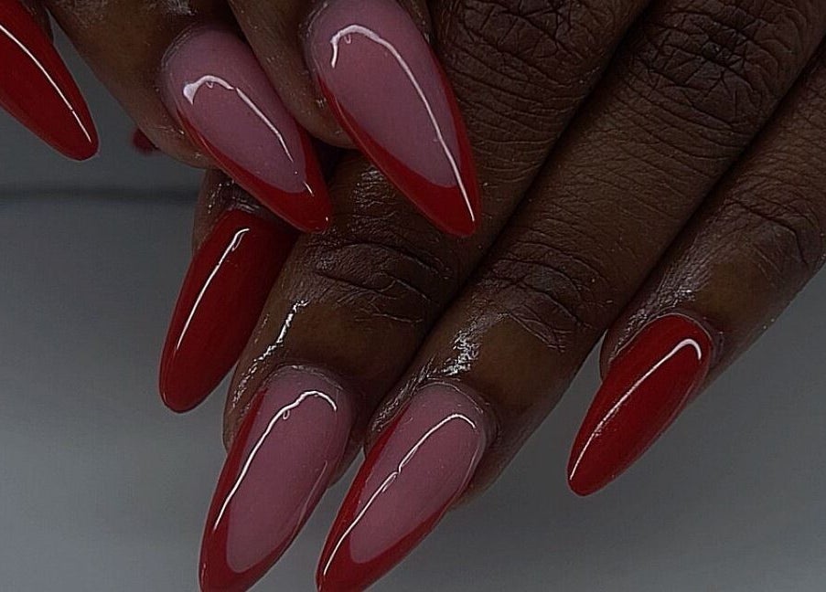 Stylish red and pink stiletto nails at Emb Luxe Nails, Eastlynne, Saint George, BB.