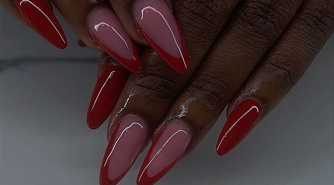 Stylish red and pink stiletto nails at Emb Luxe Nails, Eastlynne, Saint George, BB.