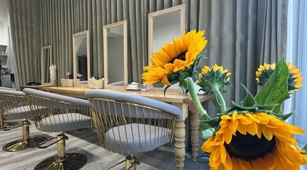 Stylish sunflower-themed salon at Irina G. Hair, London, England, GB, showcasing elegance and comfort.
