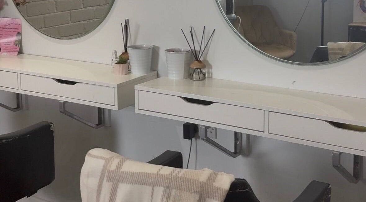 Modern beauty station at Alycelhair, Wythenshawe, England, GB, featuring elegant mirrors and chic decor.
