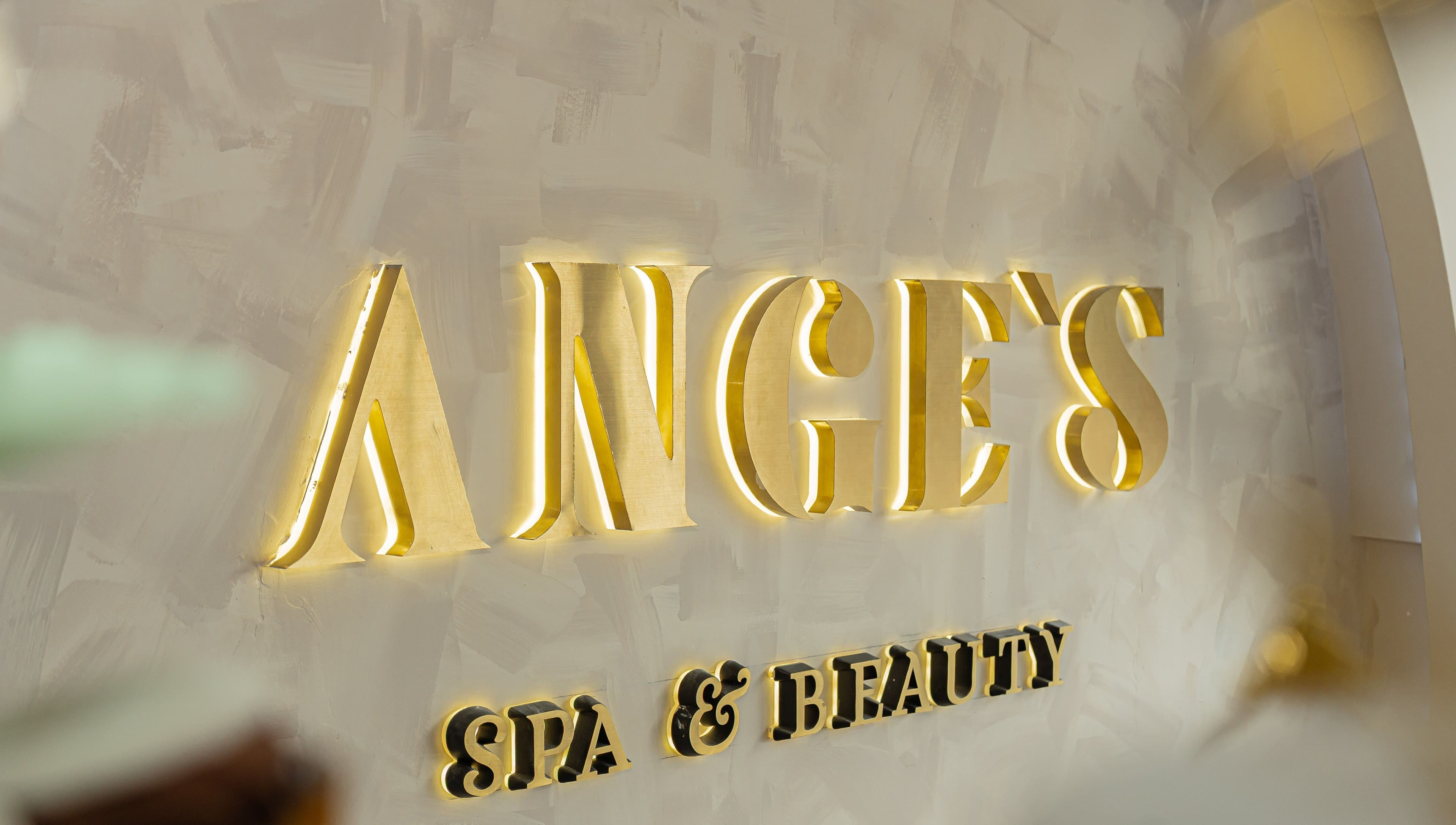 Illuminated gold signage at Ange's Spa and Beauty, Southampton, England, GB.