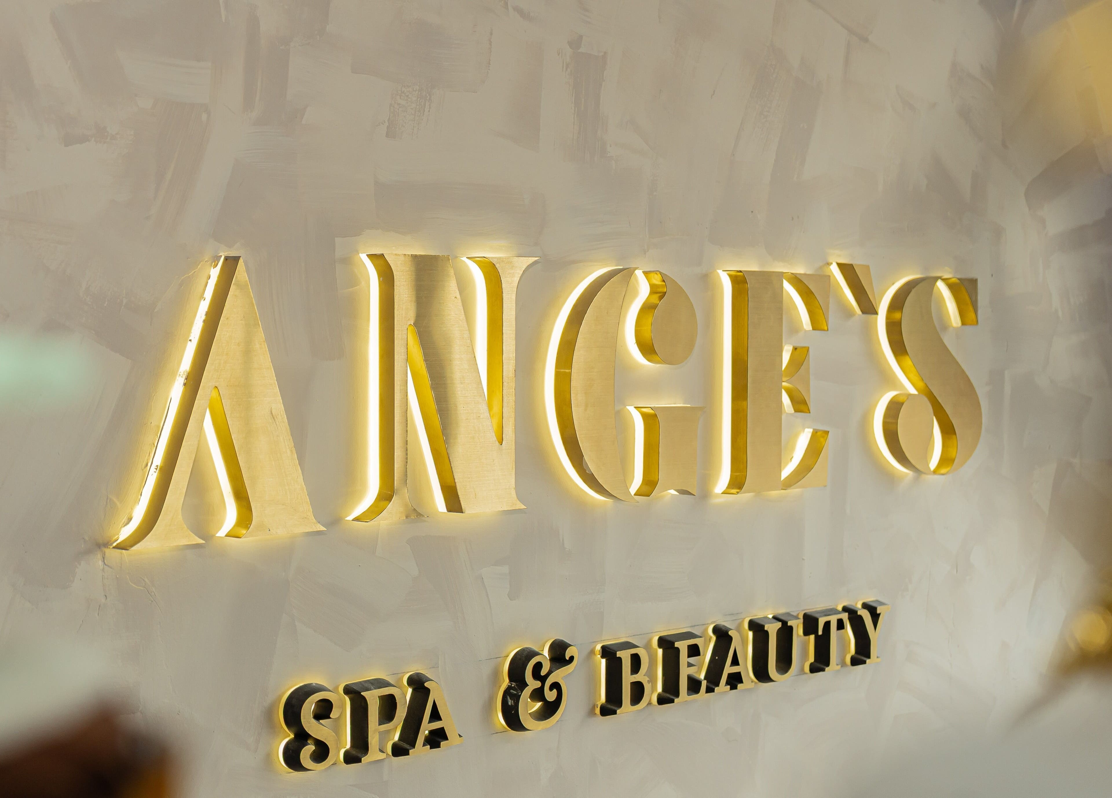 Illuminated gold signage at Ange's Spa and Beauty, Southampton, England, GB.