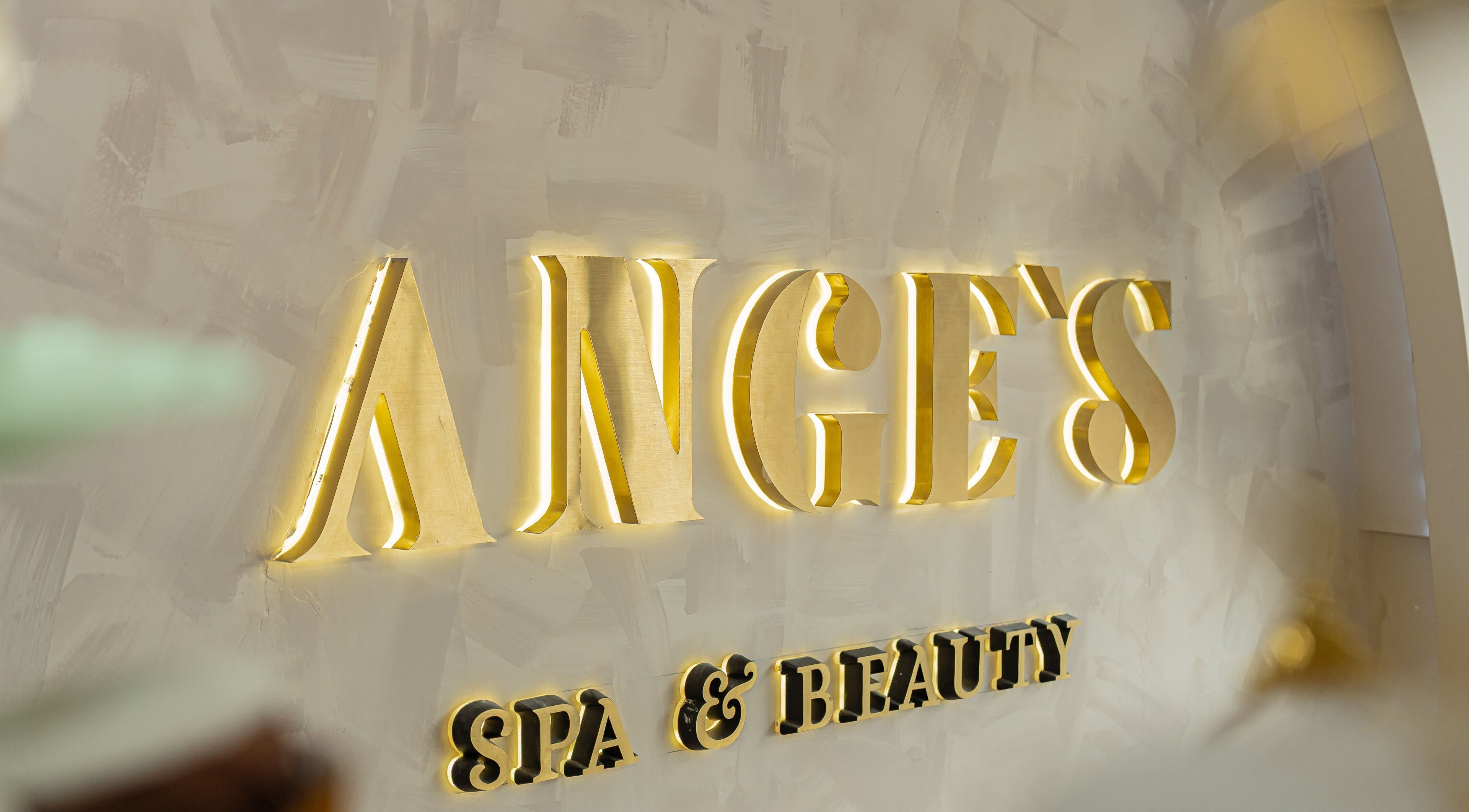 Illuminated gold signage at Ange's Spa and Beauty, Southampton, England, GB.
